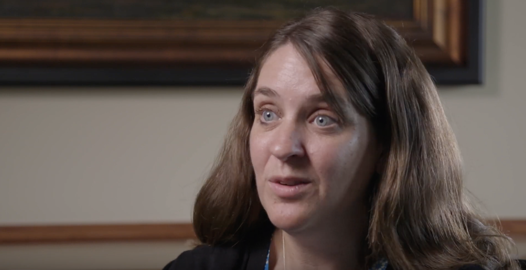 white woman with brown hair being interviewed