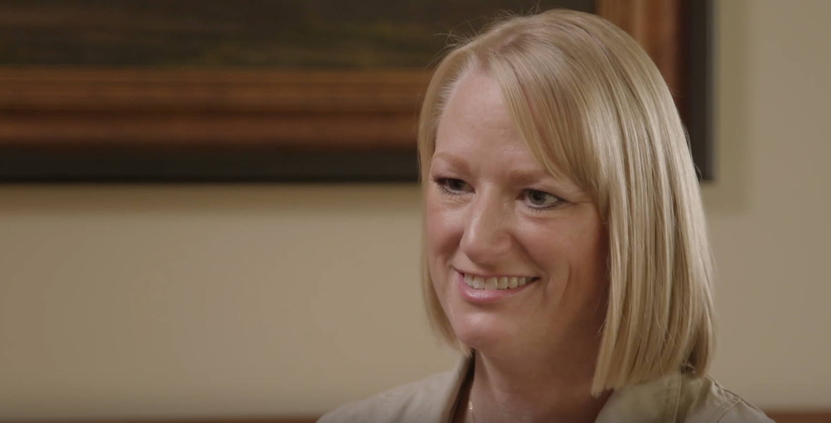 white woman with blonde hair being interviewed