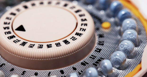 closeup of a pack of oral contraceptives with abbreviations for the days of the week 