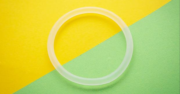 the ring birth control on a yellow and green background